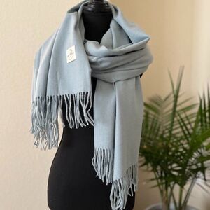 Blue Soft  warm scarf is a mixture of  polyester and viscose condition is new